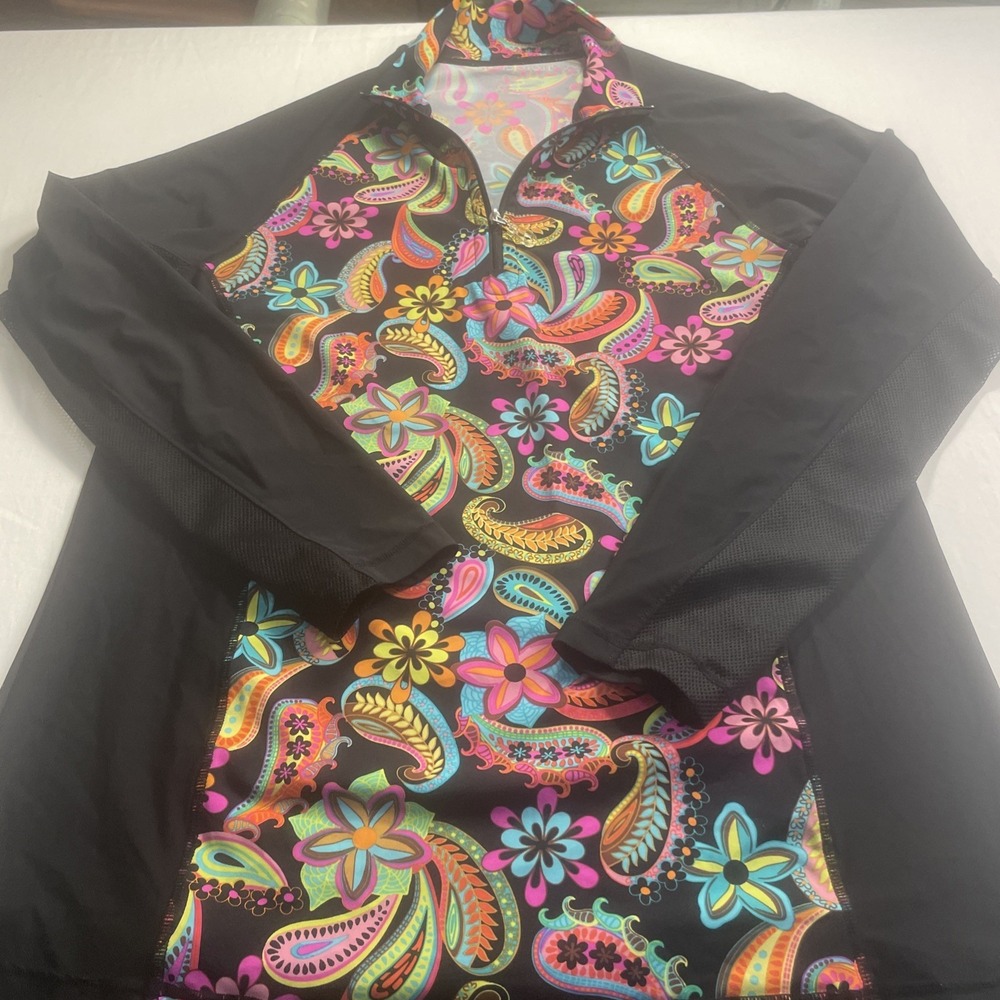 This is a SanSoleil UPF 50+ women's long sleeve quarter-zip golf/sun shirt.